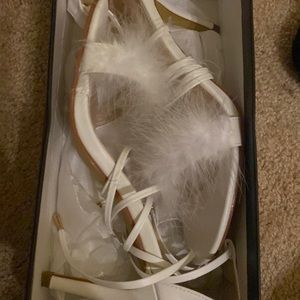 White strap up heels with fur